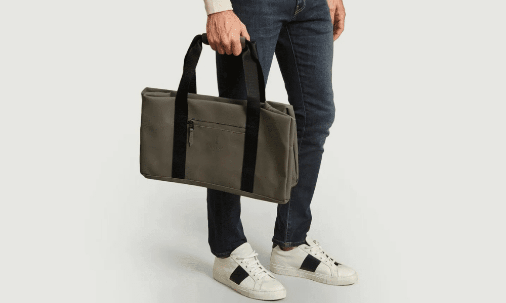 model holding gym bag